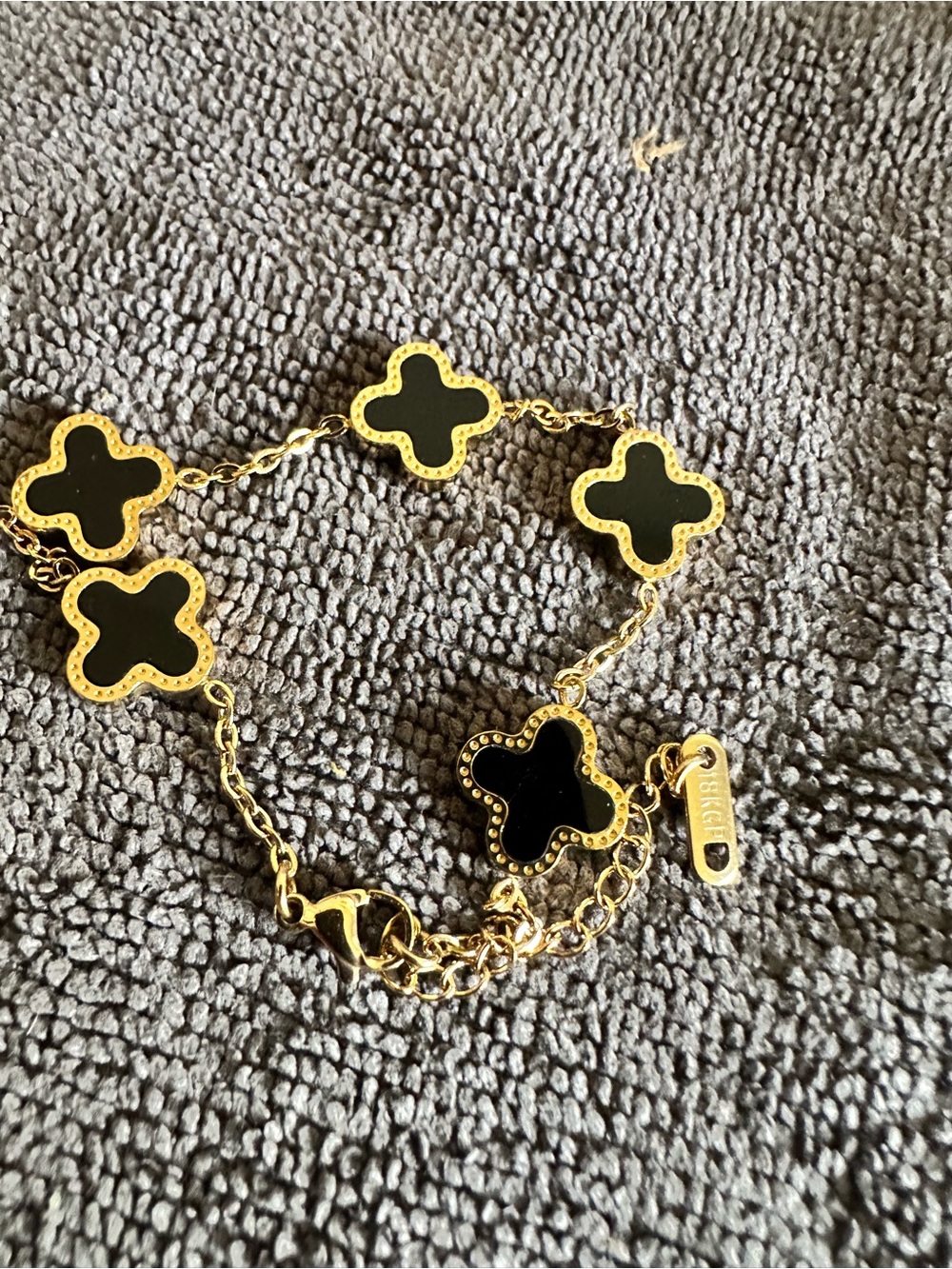 Gold-Tone Bracelet with Black Clover Charms